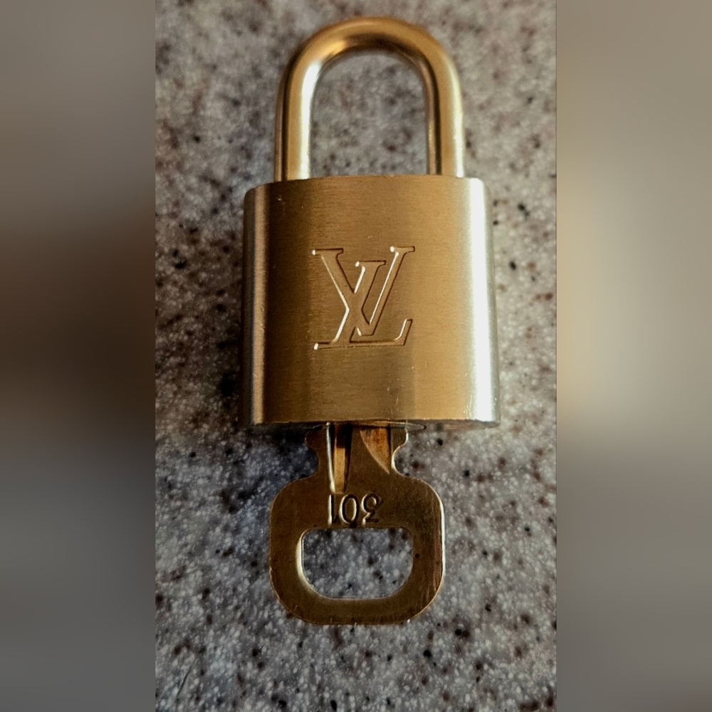 Louis Vuitton authentic padlock and key beautiful.
